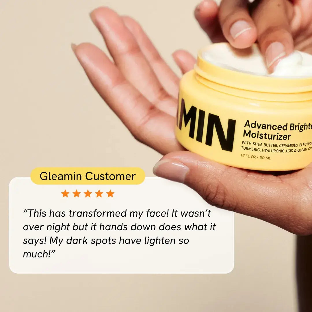 Hand holding Gleamin Advanced Brightening Moisturizer jar with customer testimonial.