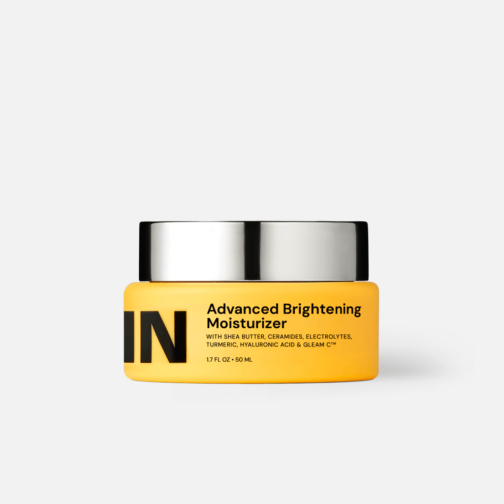 Jar of Advanced Brightening Moisturizer featuring a bright yellow design with black text.