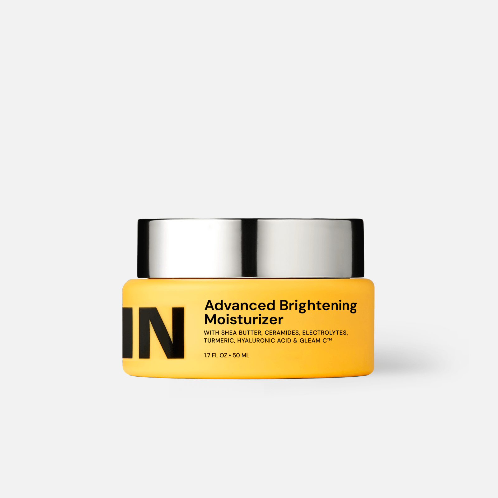 Jar of Advanced Brightening Moisturizer featuring a bright yellow design with black text.